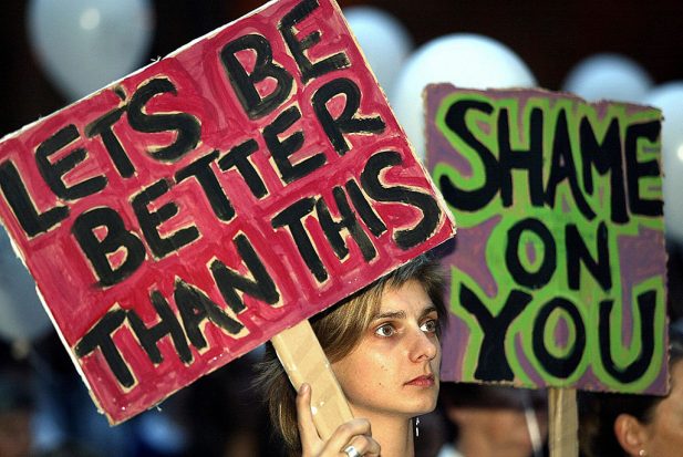 Concerned parents with placards join sch