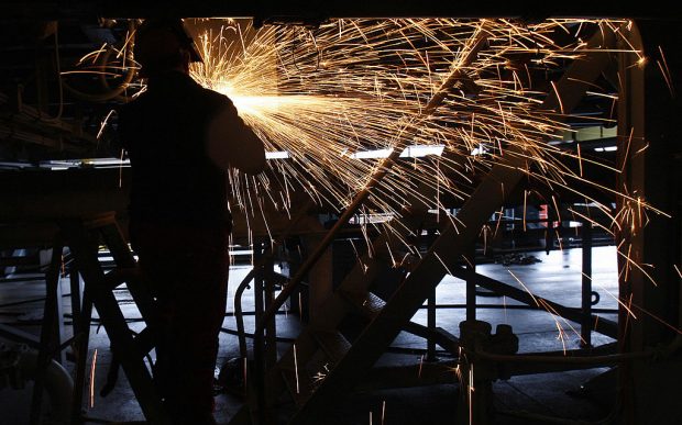 A welder works on the Royal Navy's suppl